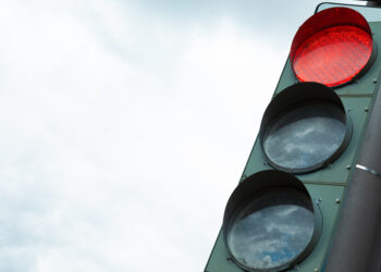 Traffic-light with red light prohibiting traffic flow