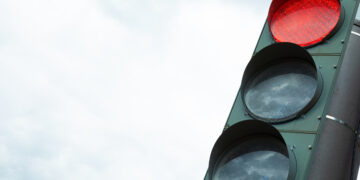 Traffic-light with red light prohibiting traffic flow