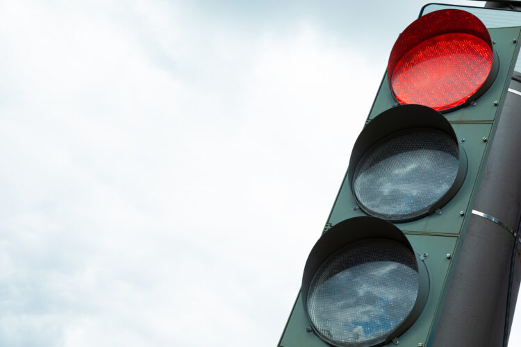 Traffic-light with red light prohibiting traffic flow